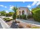 Single story home with arched entryway and landscaping at 10737 E Simone Ave, Mesa, AZ 85212