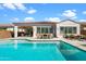 Resort-style backyard boasting a beautiful pool and patio furniture at 10737 E Simone Ave, Mesa, AZ 85212