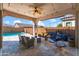 Relaxing backyard oasis featuring a sparkling pool and patio furniture at 10737 E Simone Ave, Mesa, AZ 85212