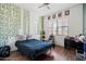 Cozy bedroom with leafy wall decor and a comfortable bed at 10737 E Simone Ave, Mesa, AZ 85212