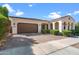 Beautiful home exterior with a large garage and manicured landscaping at 10737 E Simone Ave, Mesa, AZ 85212