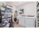 Bright laundry room, washer, dryer, and ample storage at 1609 E Montecito Ave, Phoenix, AZ 85016