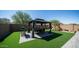 Backyard with gazebo, artificial turf, and playset at 16543 W Alameda Rd, Surprise, AZ 85387