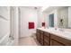 Double sink bathroom with toilet and linen storage at 16543 W Alameda Rd, Surprise, AZ 85387