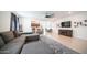 Bright living room features an open floor plan, looking into the kitchen and dining area at 16543 W Alameda Rd, Surprise, AZ 85387