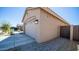 View of garage and walkway to a tan house at 16543 W Alameda Rd, Surprise, AZ 85387