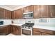 Modern kitchen with stainless steel appliances and ample counter space at 16543 W Alameda Rd, Surprise, AZ 85387