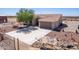 House with a large driveway and landscaped front yard, offering ample space at 3630 N 372Nd Ln, Tonopah, AZ 85354