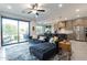 Open-concept living area with kitchen and patio access at 142 E Hearne Way, Gilbert, AZ 85234