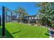 Artificial turf lawn with modern building in background at 142 E Hearne Way, Gilbert, AZ 85234
