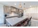 Modern kitchen with wood cabinets, island, and breakfast nook at 142 E Hearne Way, Gilbert, AZ 85234