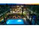 Aerial view of a community pool and surrounding modern building at night at 142 E Hearne Way, Gilbert, AZ 85234