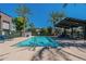 Relaxing community pool with lounge chairs and shade at 142 E Hearne Way, Gilbert, AZ 85234