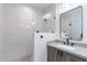 Clean bathroom with a single vanity, shower, and modern fixtures at 142 E Hearne Way, Gilbert, AZ 85234