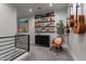 Cozy loft area with a rocking chair, record collection, and guitars at 142 E Hearne Way, Gilbert, AZ 85234