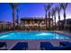 Inviting pool area with lounge chairs and a pergola, perfect for relaxing evenings at 142 E Hearne Way, Gilbert, AZ 85234