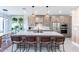 Modern kitchen with wood cabinets and large island at 142 E Hearne Way, Gilbert, AZ 85234