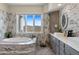 Bathroom with a soaking tub, double vanity, and mountain views at 37325 N 29Th Ave, Phoenix, AZ 85086