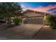House exterior at sunset, showcasing curb appeal at 1448 E Poncho Ln, San Tan Valley, AZ 85143