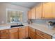 Modern kitchen sink and light wood cabinets at 1448 E Poncho Ln, San Tan Valley, AZ 85143