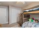 bedroom with bunk beds and double door closet at 1448 E Poncho Ln, San Tan Valley, AZ 85143