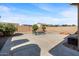 Large backyard patio with fire pit and sitting area at 1448 E Poncho Ln, San Tan Valley, AZ 85143