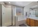 Double vanity, soaking tub and walk-in shower in this bathroom at 1448 E Poncho Ln, San Tan Valley, AZ 85143