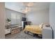 Bright bedroom with a double bed, built-in shelving, and a large window at 1448 E Poncho Ln, San Tan Valley, AZ 85143