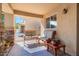 Covered front porch with seating area, perfect for relaxing at 1448 E Poncho Ln, San Tan Valley, AZ 85143