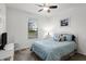 Cozy bedroom with a queen-size bed, and a view at 41692 W Monsoon Ln, Maricopa, AZ 85138