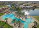 Relax by the resort-style pool with lake views at 41692 W Monsoon Ln, Maricopa, AZ 85138