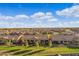 Aerial view of houses and community, showcasing surrounding landscape at 41692 W Monsoon Ln, Maricopa, AZ 85138