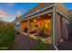 Evening view of the covered patio with seating at 41692 W Monsoon Ln, Maricopa, AZ 85138