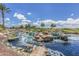 Serene water feature with a waterfall and pond at 41692 W Monsoon Ln, Maricopa, AZ 85138