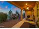 Covered patio with seating area and fire pit at 41692 W Monsoon Ln, Maricopa, AZ 85138