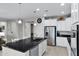 Open concept kitchen with large island, stainless steel appliances, and granite countertops at 41692 W Monsoon Ln, Maricopa, AZ 85138
