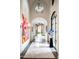 Elegant hallway with high ceilings, arched doorways, and artwork at 11200 E Canyon Cross Way, Scottsdale, AZ 85255