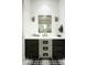Modern bathroom with dark vanity and mosaic tile floor at 11200 E Canyon Cross Way, Scottsdale, AZ 85255