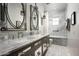 Spa-like bathroom with marble finishes, double vanity and bathtub at 11200 E Canyon Cross Way, Scottsdale, AZ 85255