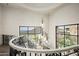 Upper landing of a grand staircase with chandelier and mountain views at 11200 E Canyon Cross Way, Scottsdale, AZ 85255