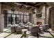 Outdoor patio with fireplace, seating area, and a view into the home at 11200 E Canyon Cross Way, Scottsdale, AZ 85255