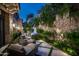 Landscaped side yard with seating area and fountain feature at 11200 E Canyon Cross Way, Scottsdale, AZ 85255