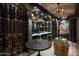 Custom wine cellar with extensive shelving and barrel storage at 11200 E Canyon Cross Way, Scottsdale, AZ 85255