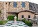 Charming courtyard with fountain and lush landscaping at 11200 E Canyon Cross Way, Scottsdale, AZ 85255