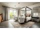Spacious bedroom with four-poster bed and sitting area at 11200 E Canyon Cross Way, Scottsdale, AZ 85255