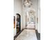 Elegant hallway with high ceilings, arched doorways, and artwork at 11200 E Canyon Cross Way, Scottsdale, AZ 85255