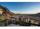 Balcony view overlooking mountain landscape and houses below at 11200 E Canyon Cross Way, Scottsdale, AZ 85255