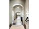 Bright entryway with high ceilings, arched doorways, and marble flooring at 11200 E Canyon Cross Way, Scottsdale, AZ 85255