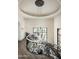 Upper landing of a grand staircase, featuring a chandelier and views at 11200 E Canyon Cross Way, Scottsdale, AZ 85255