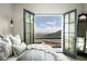 Bedroom with mountain views and access to private balcony at 11200 E Canyon Cross Way, Scottsdale, AZ 85255